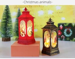 Close-up of LED Christmas lanterns with Santa and reindeer motifs in a festive setting