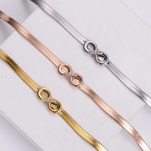Infinity symbol flat snake chain bracelets in gold, silver, and rose gold with rhinestones