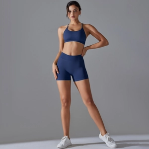 Detail of dark blue seamless yoga set with thin strap sports bra and high waist shorts