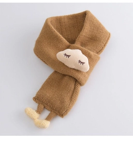 Close-up of soft brown knitted baby scarf with white cloud and yellow pompoms detail