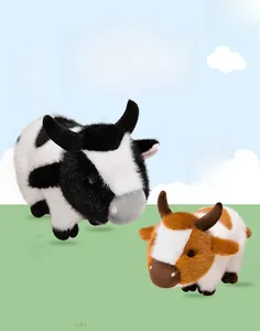 Detail view of brown and black spotted plush cow dolls with soft texture and 3D design