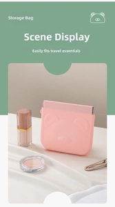 Pink silicone squeeze pouch with cute bear face for organizing lipsticks and gadgets