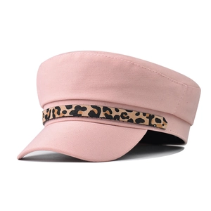 Detailed view of pink cotton newsboy cap with a stylish leopard print decorative band