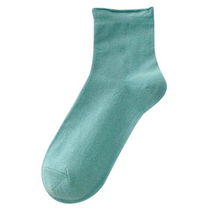 Teal cotton knit crew socks with minimalist rolled edge design on white background