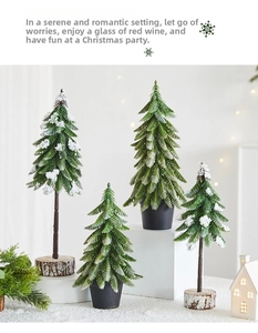 Close-up of mini artificial Christmas trees with snow effect and wooden bases for decor