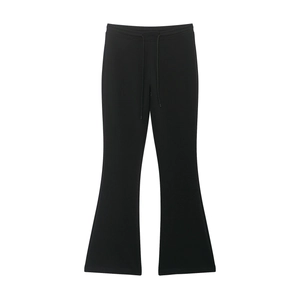 Detail of black flared casual joggers with drawstring waist and slim-fit knitted fabric