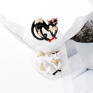 Creative Egyptian cat brooch with enamel finish and sparkling crystals in black and white