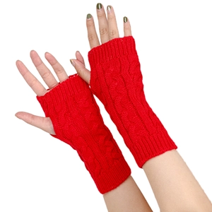 Detailed close-up of red cable knit arm warmers with fingerless design and textured patterns
