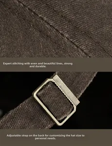 Detail of adjustable metal buckle and stitching on a vintage washed baseball cap