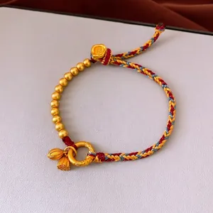 Handmade woven rope bracelet with lotus charms and golden beads in neo-Chinese retro style