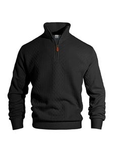 Close-up of black men's 1/4 zip sweater showing mixed diamond and stripe knit textures