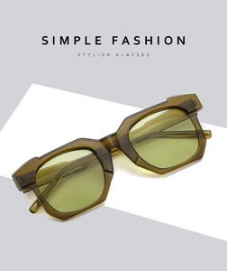 Detailed macro view of ZN3625 irregular green sunglasses frame with model specifications