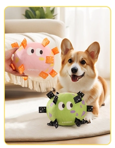 Macro detail of plush dog soccer balls with colorful ribbons and bell for pet interactive play