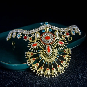 Luxurious gold crown armlet with pearls and colorful rhinestones in a peacock design