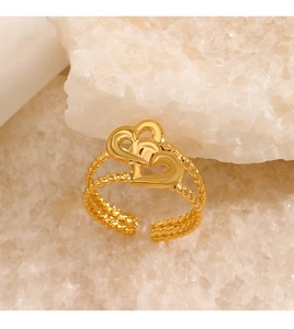 Detailed macro shot of a double heart 18K gold-plated adjustable ring on stone
