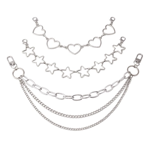Macro detail of multi-layer metal bag chains featuring heart and star links with lobster clasps