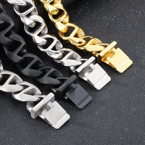 Detail of Cuban link bracelets in gold, silver, and matte black steel finishes