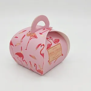 Detail of pink heart-shaped gift box with flamingo prints and SPECIALLY FOR YOU text