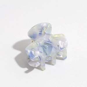 Macro detail of lavender and blue marble acetate hair claw clip with glossy finish