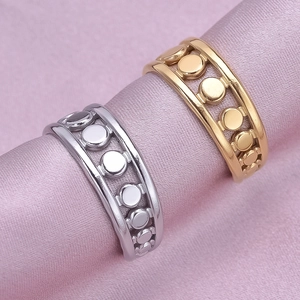 Minimalist 304 stainless steel open circle rings in gold and silver on pink silk