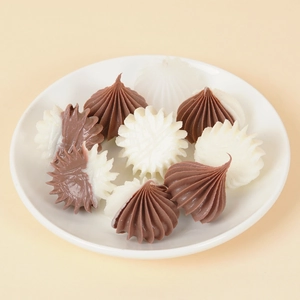 Miniature dollhouse cream cake topper accessories with textured icing swirl design