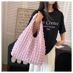 Pink puff pleated shoulder bag featuring soft textured seersucker fabric and floral design