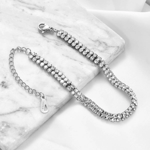 Detailed macro shot of a double-row crystal bracelet with lobster clasp and extension chain