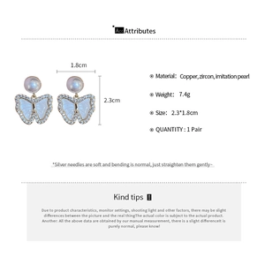 Detailed view of butterfly stud earrings with dimensions and zircon pearl materials