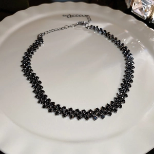 Chic black rhinestone geometric choker necklace on white ceramic tray for women