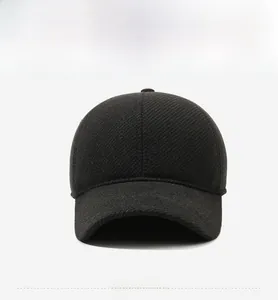 Detail of winter baseball cap with silver metal Jeans script on twill texture fabric
