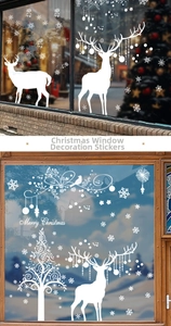 Detail of white Christmas elk and snowflake static window stickers for festive shop glass decor