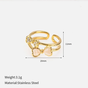 Double layered bow knot ring in gold stainless steel with sparkling crystals and opal