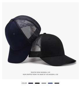 Detail of navy and black trucker caps featuring breathable mesh and structured panels