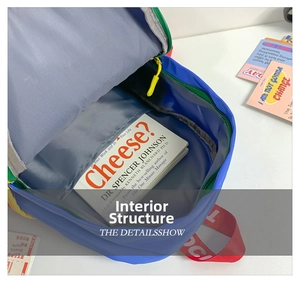 Internal view of blue canvas kids backpack showing spacious main compartment and grey divider