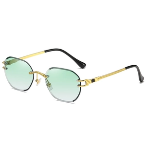 Fashionable rimless sunglasses with green gradient lenses and gold woven metal frame