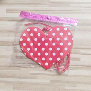 Hanging heart garland with red and white polka dots for romantic Valentine decor