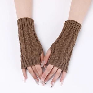 Detailed close-up of brown cable knit pattern on warm winter fingerless arm warmers