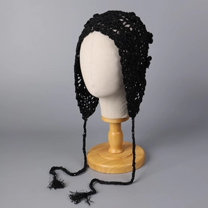 Retro black crochet bonnet with floral hollow knit design and fringe ties for women