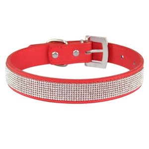 Sparkling red pet collar with rows of rhinestones and a silver metal buckle on white background