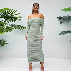 Detail of light green off-shoulder ruched mesh dress with elegant bodycon fit