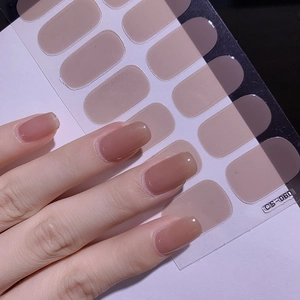 Detail of semi-cured nude pink gel nail stickers CS-060 applied on manicured hands
