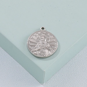 Polished silver stainless steel medallion pendant with religious Sacred Heart engraving