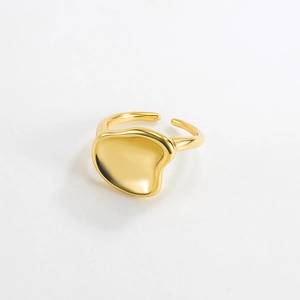 Detail showing irregular gold geometric S925 silver ring with a polished pebble texture