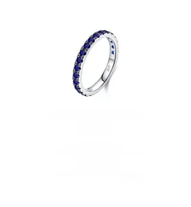 Macro shot of S925 sterling silver ring featuring claw-set blue round-cut stones