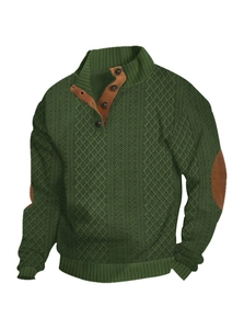 Detail of dark green knit sweater featuring stand collar buttons and brown elbow patches