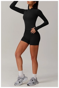 Detail of black hooded zip jacket with thumbholes and matching athletic shorts set