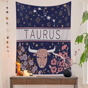 Detail of Taurus zodiac wall tapestry with gold constellations and floral bull motifs