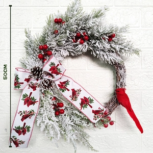 Close-up of a 50cm Christmas wreath with red cardinals, berries, and pinecones