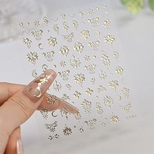 Close-up of golden star and moon nail art stickers C7304 with delicate hollow design
