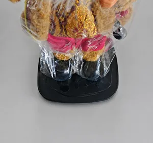 Standing Santa Claus figurine being weighed on a digital scale showing 185 grams
